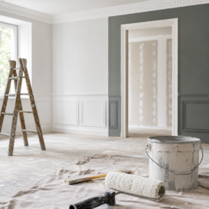 Artisan peintre réalisant des travaux de peinture et rénovation dans un appartement à Écully